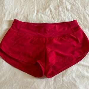 Red Lululemon speed up shorts 2.5 inches in size 4.